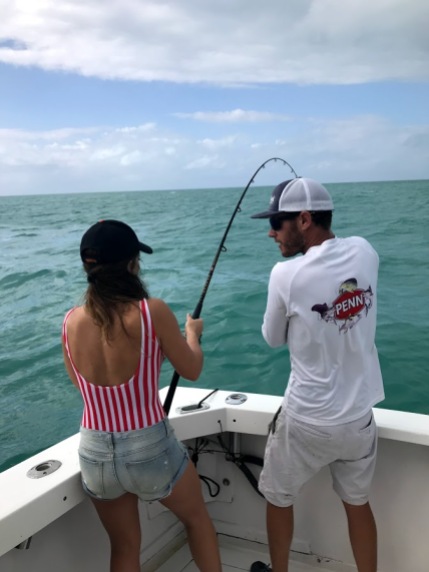 Aly Struggling to Haul in Her Baby Shark Catch.